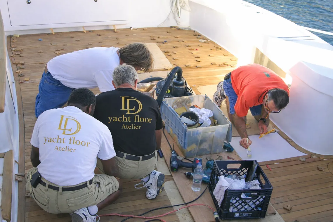 Lawson Deco team during a yacht flooring installation project